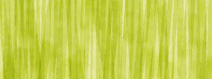 Vertical stains of light green watercolor paint on texture paper