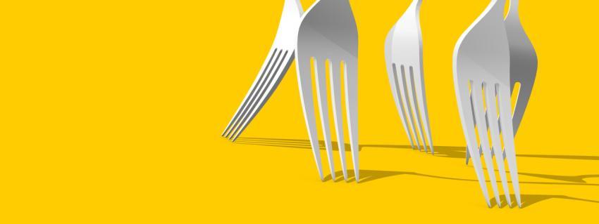 Fork on a yellow background. Forks for the design of a restaurant, cafe, pizzeria. Minimalistic kitchen fork design for advertising purposes
