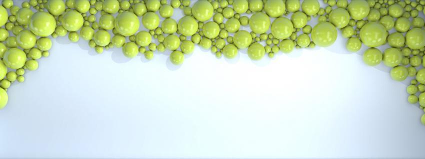 Green pearls of different sizes are scattered on a light blue background. Modern beautiful background