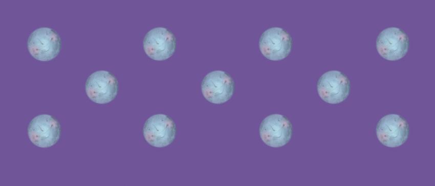 regular pattern of smiling moons on a violet background
