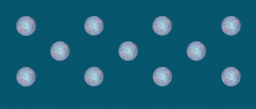 regular pattern of smiling moons on a green-blue background