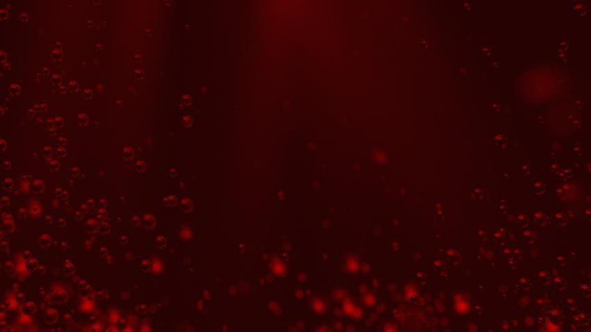 Red background with air bubbles underwater.