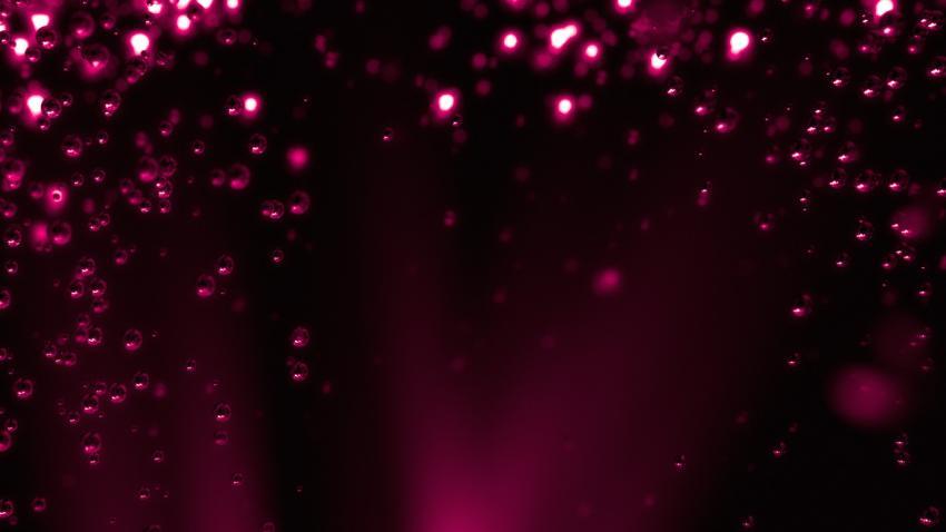 Pink background with air bubbles underwater.