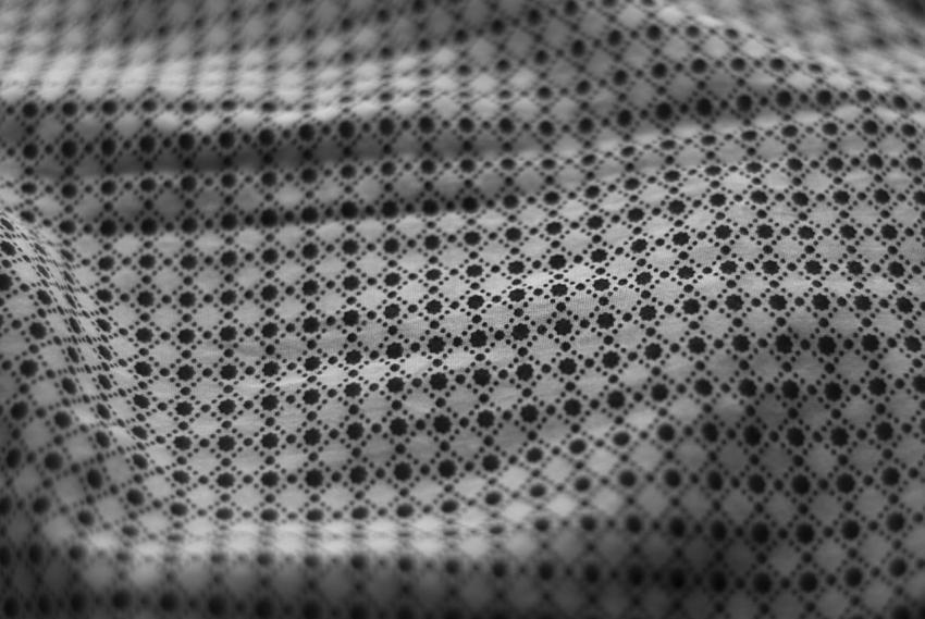 White fabric texture with black pattern