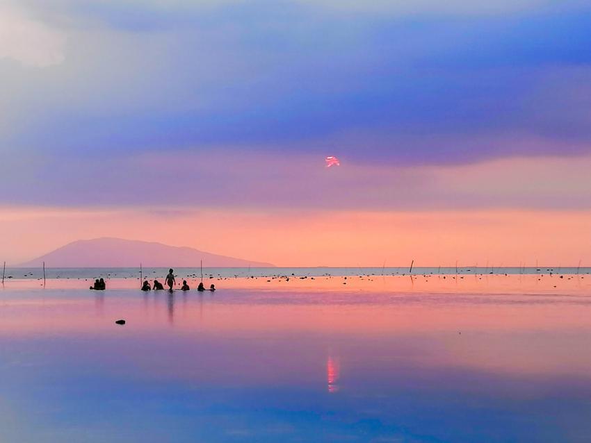 silhouettes of people at sunset