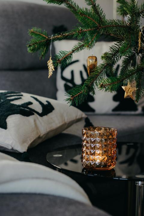 Christmas tree in a living room next to a sofa