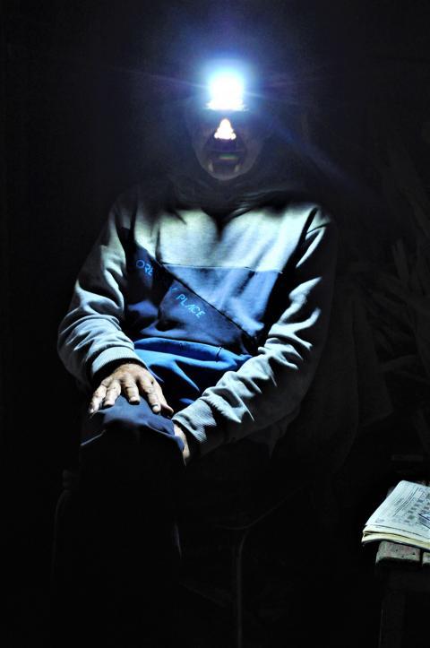 man with a lantern on his head