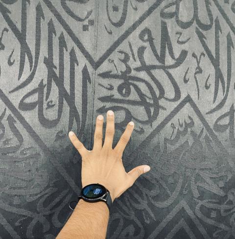 Hand on the background of the inscriptions